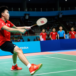베네딕트 라하드 배드민턴 올림픽 경기 - **Image Prompt:** Dynamic action shot of Benedikt Rahard, a young Indonesian badminton player, mid-s...